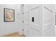 Hallway featuring pristine white walls, stylish doors, modern artwork, and elegant trim work at 48 Sandpiper Rd, Tampa, FL 33609