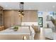 Modern kitchen with a large island, breakfast bar, and wooden cabinets and a view of the staircase at 48 Sandpiper Rd, Tampa, FL 33609
