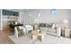 Comfortable living room featuring stylish decor, a modern sofa, and access to dining area at 48 Sandpiper Rd, Tampa, FL 33609