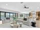 Bright and open living room with contemporary furniture, large windows and great views at 48 Sandpiper Rd, Tampa, FL 33609