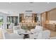Open-concept living space featuring a modern kitchen, dining area, and sitting space with lots of natural light at 48 Sandpiper Rd, Tampa, FL 33609