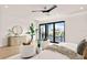 Airy main bedroom with waterfront view, light hardwood floors, modern decor, and stylish seating at 48 Sandpiper Rd, Tampa, FL 33609