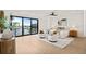 A well-lit main bedroom with water views, complete with modern furnishings and calming decor at 48 Sandpiper Rd, Tampa, FL 33609