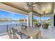 Spacious patio with waterfront views, outdoor dining area, and comfortable seating at 48 Sandpiper Rd, Tampa, FL 33609