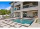 Amazing waterfront pool with stepping stones, and a covered outdoor living and entertaining space at 48 Sandpiper Rd, Tampa, FL 33609