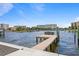 Picturesque waterfront view with a private boat dock, offering direct access to calm, open waters at 48 Sandpiper Rd, Tampa, FL 33609