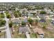 Stunning aerial perspective of a house set within a picturesque neighborhood with green spaces at 5134 Jenson Ave, Spring Hill, FL 34608