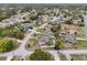 Scenic aerial view showcasing a home nestled in a charming neighborhood with manicured lawns at 5134 Jenson Ave, Spring Hill, FL 34608