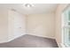 Bedroom featuring a double-door closet and window for natural light at 5134 Jenson Ave, Spring Hill, FL 34608