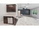 Eat-in kitchen showcasing granite countertops, stainless steel appliances, a breakfast bar, and ample storage at 5134 Jenson Ave, Spring Hill, FL 34608
