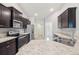 Modern kitchen boasts stainless steel appliances, granite countertops, and ample cabinet space for storage at 5134 Jenson Ave, Spring Hill, FL 34608