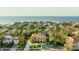 Stunning aerial view of a luxurious home with mature landscaping near the water at 5910 La Rosa Ln, Apollo Beach, FL 33572