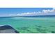 Panoramic aerial shot reveals a vast ocean dotted with boats under a blue sky with scattered clouds at 5910 La Rosa Ln, Apollo Beach, FL 33572