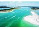 Expansive aerial view of boats cruising along clear waters and sandy shores, a perfect seaside destination at 5910 La Rosa Ln, Apollo Beach, FL 33572