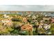 Expansive view shows property with backyard pool and lush landscaping in a waterfront community at 5910 La Rosa Ln, Apollo Beach, FL 33572