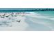 Beautiful beach scenery filled with seabirds by the water and the ocean water at the shore at 5910 La Rosa Ln, Apollo Beach, FL 33572