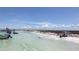 Picturesque beach featuring clear water, white sand, and beachgoers enjoying the sunny day at 5910 La Rosa Ln, Apollo Beach, FL 33572