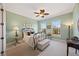 Charming bedroom with a decorative iron bed frame, soft green walls, and bright natural light at 5910 La Rosa Ln, Apollo Beach, FL 33572