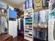 Organized walk-in closet with custom shelving, drawers, and hanging racks for ample storage solutions at 5910 La Rosa Ln, Apollo Beach, FL 33572