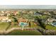 Aerial view of community pool, playground, and tennis courts with bay access at 5910 La Rosa Ln, Apollo Beach, FL 33572
