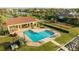 Overhead view of community pool, playground, and nearby tennis courts offers great recreation for residents at 5910 La Rosa Ln, Apollo Beach, FL 33572