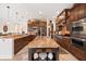 Well-appointed kitchen with a large center island, granite countertops, and plenty of storage space at 5910 La Rosa Ln, Apollo Beach, FL 33572
