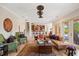 Living room is bathed in natural light and features comfortable seating and stylish decor at 5910 La Rosa Ln, Apollo Beach, FL 33572