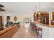 Open-concept living room with breakfast bar, flowing into a bright and inviting space at 5910 La Rosa Ln, Apollo Beach, FL 33572