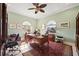 Office space with vintage furniture, a ceiling fan, and two windows for natural light at 5910 La Rosa Ln, Apollo Beach, FL 33572