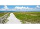 Picturesque path leading to the beach, offering a tranquil and scenic route for residents at 5910 La Rosa Ln, Apollo Beach, FL 33572