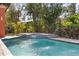 Close-up view of sparkling pool with integrated spa and soothing water features at 5910 La Rosa Ln, Apollo Beach, FL 33572