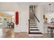 A traditional staircase offers convenient access to the home's second story, complemented by the adjacent dining room at 5910 La Rosa Ln, Apollo Beach, FL 33572