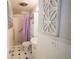 Tidy bathroom featuring a walk-in shower and black and white tile at 6007 Murray Hill Dr, Tampa, FL 33615