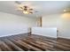 Spacious open bonus room with lots of space and light, featuring hardwood flooring at 6527 Mayport Dr, Apollo Beach, FL 33572