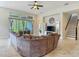 Large living room and stairway with sliding doors to backyard and a large sectional sofa at 6527 Mayport Dr, Apollo Beach, FL 33572