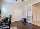 Spacious office with a large desk and chair, wood floors, and a double door closet at 6527 Mayport Dr, Apollo Beach, FL 33572