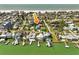 Coastal home near beach with private docks, showcasing waterfront living and neighborhood charm at 720 Bay Esplanade, Clearwater Beach, FL 33767