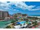 Overhead view highlighting the sparkling pool, waterways, and stunning coastal skyline near the property at 720 Bay Esplanade, Clearwater Beach, FL 33767
