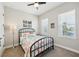 Bright bedroom with large windows, neutral carpeting, and a ceiling fan at 720 Bay Esplanade, Clearwater Beach, FL 33767