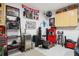 Garage is well-lit with storage cabinets, fan, and organization for various items at 720 Bay Esplanade, Clearwater Beach, FL 33767