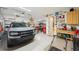 Spacious garage with epoxy floors, storage, and gray Ford Bronco at 720 Bay Esplanade, Clearwater Beach, FL 33767