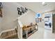 Hallway with stairs, decor, and view of garage with parked car at 720 Bay Esplanade, Clearwater Beach, FL 33767