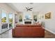 Bright living room with comfortable seating, modern fireplace, and views of lush outdoor greenery at 720 Bay Esplanade, Clearwater Beach, FL 33767