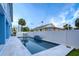 Beautiful backyard pool with relaxing lounge area, offering a private and luxurious outdoor experience in a serene setting at 720 Bay Esplanade, Clearwater Beach, FL 33767