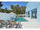 Backyard pool area with lounge chairs, perfect for outdoor relaxation and entertaining in a private setting near the home at 720 Bay Esplanade, Clearwater Beach, FL 33767