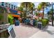 Coco's Crush Bar & Grill: An outdoor restaurant offering a tropical vibe with palm trees and colorful decor at 720 Bay Esplanade, Clearwater Beach, FL 33767