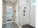 Modern glass shower with white subway tile surround and mosaic accent tile at 720 Bay Esplanade, Clearwater Beach, FL 33767