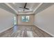 Spacious living room featuring wood-style tile flooring, recessed lighting, and a ceiling fan at 8563 Starlight Loop, Parrish, FL 34219