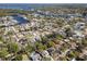 Expansive aerial shot of a residential community near a waterway, emphasizing the desirable location and surrounding landscape at 9016 Bay Ne St, St Petersburg, FL 33702