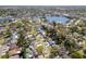 Aerial view of a neighborhood with tree-lined streets, showcasing the home's proximity to community amenities at 9016 Bay Ne St, St Petersburg, FL 33702